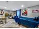 Spacious living area with comfortable seating, modern TV setup, and bright natural light at 5519 Tucson St, Denver, CO 80239