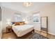 Inviting bedroom with hardwood floors, natural light, neutral walls, and tasteful decor accents at 2555 Hudson St, Denver, CO 80207