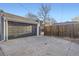 Long driveway leading to a detached garage; providing ample parking space at 2555 Hudson St, Denver, CO 80207