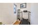 Cozy exercise room boasts a treadmill and natural light from the window at 2555 Hudson St, Denver, CO 80207