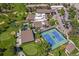 Aerial view of community amenities including a golf course, pool, tennis court, and clubhouse at 3022 S Wheeling S Way # 410, Aurora, CO 80014