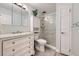 Bright bathroom featuring a vanity with drawers and walk-in shower at 3022 S Wheeling S Way # 410, Aurora, CO 80014