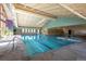 Bright indoor pool with lap lanes, ample natural light, and open ceiling design at 3022 S Wheeling S Way # 410, Aurora, CO 80014