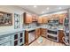 Charming kitchen features wood cabinets, granite countertops, and stainless steel appliances at 3022 S Wheeling S Way # 410, Aurora, CO 80014
