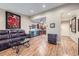 Open living room showcasing hardwood floors, stylish decor, and a glimpse of the kitchen at 3022 S Wheeling S Way # 410, Aurora, CO 80014