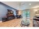 Comfortable living room with fireplace, TV, sliding door, ceiling fan and stylish decor at 3022 S Wheeling S Way # 410, Aurora, CO 80014