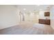 Open basement with a wet bar, recessed lighting, neutral carpeting, and ample space for various activities at 34 Sommerset Cir, Englewood, CO 80111