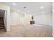 Spacious finished basement with wet bar, carpeting, and ample natural light, perfect for entertaining and relaxing at 34 Sommerset Cir, Englewood, CO 80111