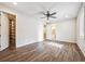 Spacious bedroom with wood floors, walk-in closet, and ensuite bathroom at 34 Sommerset Cir, Englewood, CO 80111