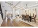 Spacious dining area with hardwood floors, decorative lighting, and an open floor plan at 34 Sommerset Cir, Englewood, CO 80111