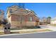 Charming two-story home featuring a combination of brick and siding, a well-manicured lawn, and a private driveway at 34 Sommerset Cir, Englewood, CO 80111