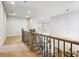 Bright hallway with staircase, chandelier, and open view to the living and dining rooms at 34 Sommerset Cir, Englewood, CO 80111