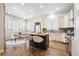 Stylish kitchen with a center island, stainless steel appliances, and breakfast nook at 34 Sommerset Cir, Englewood, CO 80111