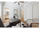 Home office with ceiling fan, desk and adjacent full bathroom at 34 Sommerset Cir, Englewood, CO 80111