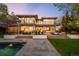 Stunning backyard featuring a pool, patio, and lush lawn perfect for outdoor entertaining at 19 S Eudora St, Denver, CO 80246