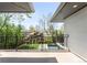 Balcony view of a backyard with a swimming pool and mature trees at 19 S Eudora St, Denver, CO 80246