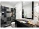 Modern bathroom with dual-tone tiling, glass shower, and sleek vanity at 19 S Eudora St, Denver, CO 80246