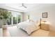 Bright bedroom featuring a walkout balcony, white walls, recessed lights, and a modern ceiling fan at 19 S Eudora St, Denver, CO 80246