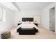 Cozy bedroom featuring a plush bed, neutral decor, and ample natural light at 19 S Eudora St, Denver, CO 80246