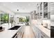 Spacious kitchen with stainless appliances, center island, and backyard access at 19 S Eudora St, Denver, CO 80246