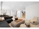 Living room with modern furnishings, neutral decor, recessed lighting, and stairway access at 19 S Eudora St, Denver, CO 80246