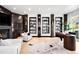 Well-lit office featuring a fireplace, custom built-ins, hardwood floors, and modern furnishings at 19 S Eudora St, Denver, CO 80246