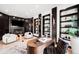 Bright office space featuring hardwood floors, custom shelving, fireplace and modern furniture at 19 S Eudora St, Denver, CO 80246