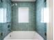 Clean shower featuring blue tile and glass doors at 19 S Eudora St, Denver, CO 80246