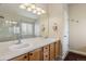 Bathroom with double sinks and cabinets providing ample storage at 4713 S Ireland St, Aurora, CO 80015
