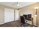 Bedroom featuring built-in closet, and desk with monitors at 4713 S Ireland St, Aurora, CO 80015