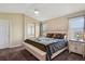 Bright bedroom features a large bed and natural light from the windows at 4713 S Ireland St, Aurora, CO 80015