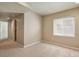 Cozy carpeted bedroom featuring a bright window and neutral paint palette at 4713 S Ireland St, Aurora, CO 80015