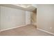 Neutral bedroom showcases carpeted floors and view to lower level stairs at 4713 S Ireland St, Aurora, CO 80015