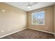 Spacious bedroom with ceiling fan and view from a large window at 4713 S Ireland St, Aurora, CO 80015
