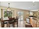 Inviting eat-in kitchen with tiled floors, a dining table, and a view of the outdoor space at 4713 S Ireland St, Aurora, CO 80015