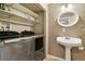 Laundry room features modern washer and dryer with open shelving at 4713 S Ireland St, Aurora, CO 80015