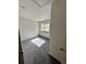Bright bedroom featuring neutral carpet, white walls, and a window with natural light at 780 2Nd St, Bennett, CO 80102
