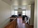 A spacious living room featuring hardwood floors, a fireplace, and lots of natural light at 780 2Nd St, Bennett, CO 80102