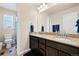 Bathroom with a double vanity and shower/tub combo at 9066 Sandpiper Dr, Frederick, CO 80504