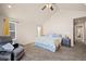 Bright bedroom with a king-size bed and access to the bathroom at 9066 Sandpiper Dr, Frederick, CO 80504