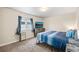 Basement bedroom with a queen-size bed, dresser, and window at 9066 Sandpiper Dr, Frederick, CO 80504