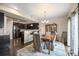 Kitchen and dining area with hardwood floors and a view to the backyard at 9066 Sandpiper Dr, Frederick, CO 80504