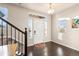 Bright entryway with hardwood floors and a view to staircase at 9066 Sandpiper Dr, Frederick, CO 80504