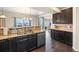 Modern kitchen with granite countertops, double sink, and ample cabinet space at 9066 Sandpiper Dr, Frederick, CO 80504