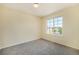 Inviting bedroom with neutral carpeting and a large window offering ample natural light at 5255 Memphis St # 315, Denver, CO 80239