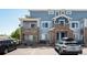Inviting exterior of a multi-story home with stone accents and a private balcony at 5255 Memphis St # 315, Denver, CO 80239