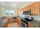 Functional kitchen equipped with stainless steel appliances and light wood cabinetry at 5255 Memphis St # 315, Denver, CO 80239
