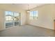 Well-lit living room with balcony access and a view of the surrounding neighborhood at 5255 Memphis St # 315, Denver, CO 80239