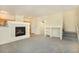 Cozy living room with a tiled fireplace and stairway leading to the second floor at 5255 Memphis St # 315, Denver, CO 80239