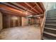 Unfinished basement with exposed beams and mechanicals awaiting your personal touch at 4445 S Lowell Blvd, Denver, CO 80236